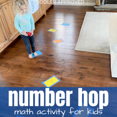 Child hopping across floor on paper numbers