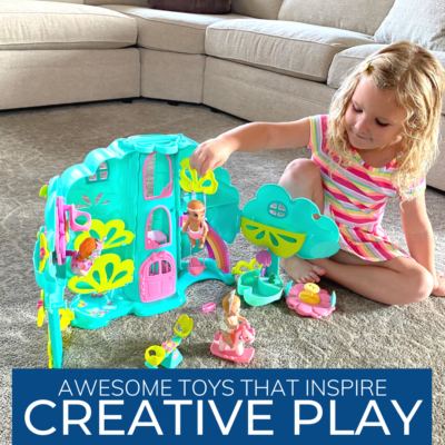 Girl playing with a Baby born Surprise™ playset.
